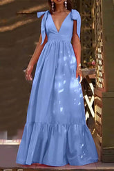 Vestido largo con volantes escalonados, cuello en V y tirantes anudados